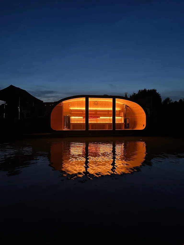 Exterior of the floating sauna at West Country Water Park, North Bristol, with pricing for 60-minute sessions