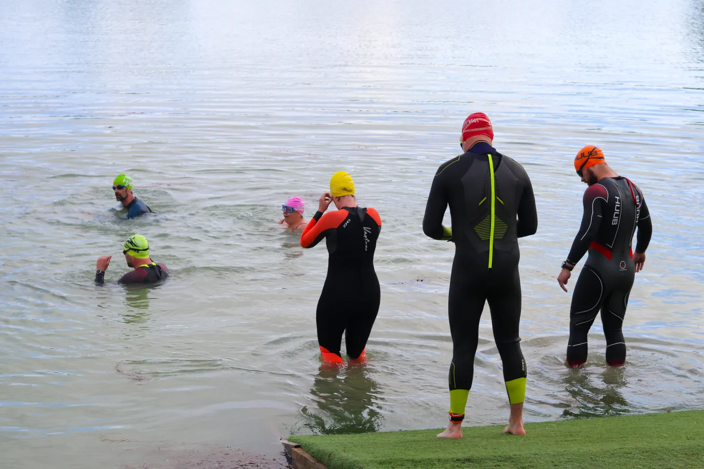 Open water swimmer in wetsuit at West Country Water Park lake near Bristol