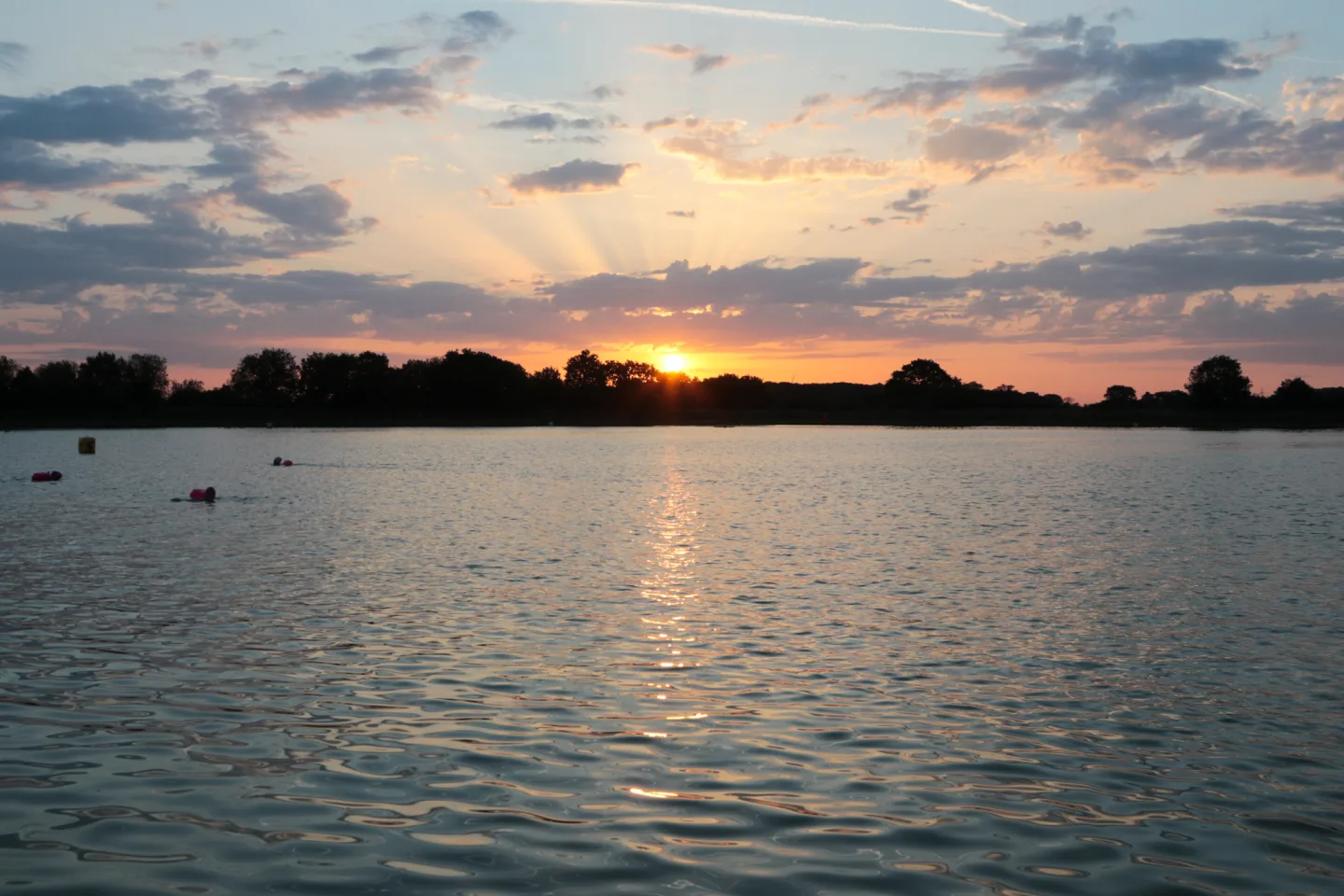 Swimmers enjoying exclusive private lake hire at West Country Water Park, North Bristol