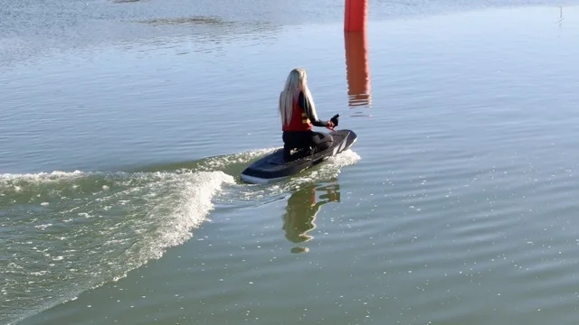 E-foil rider gliding above the water during a foil boarding lesson at West Country Water Park near Bristol